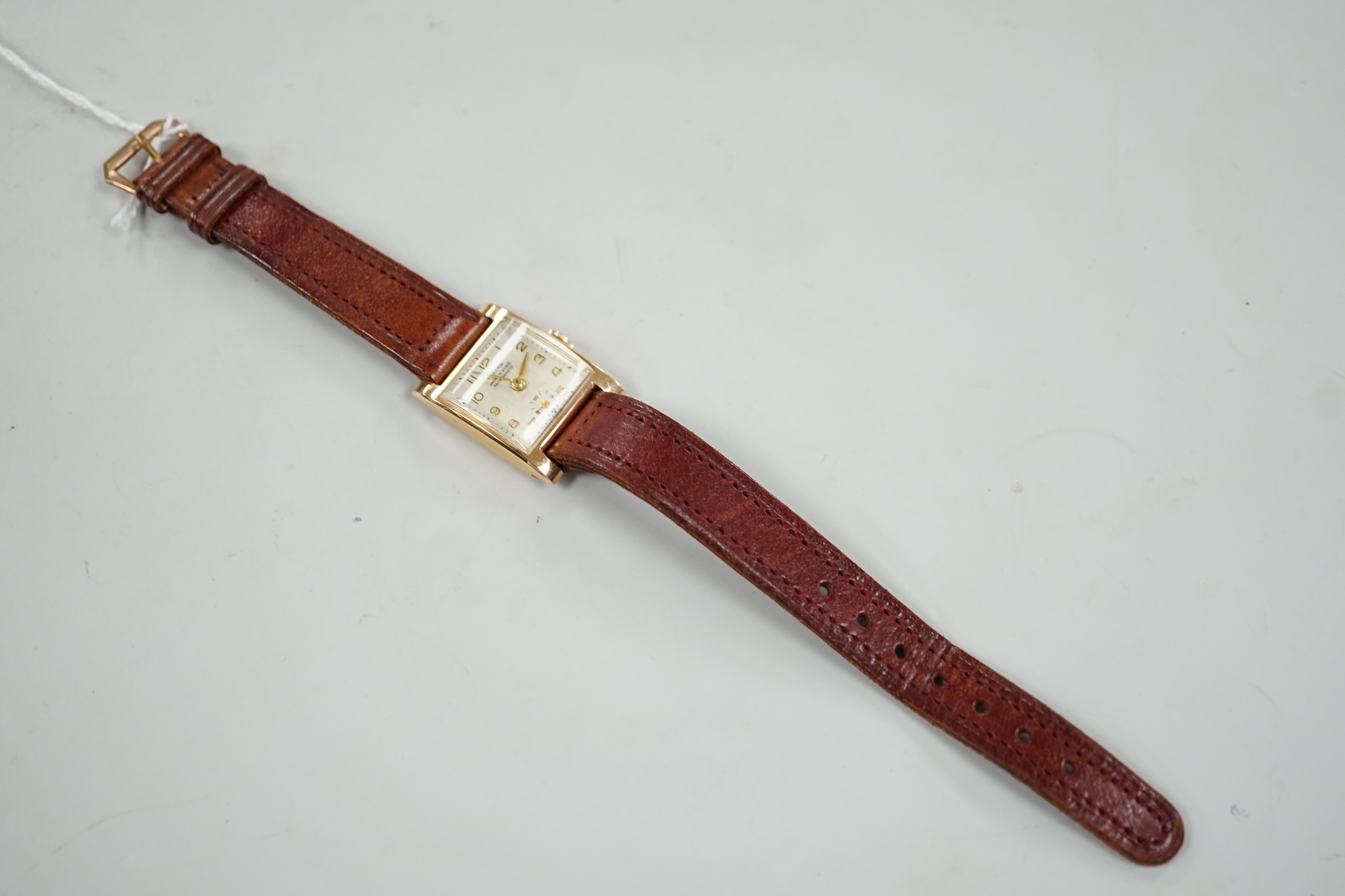 A lady's 18k Pallas manual wind wrist watch, on a leather strap, case diameter 21mm.